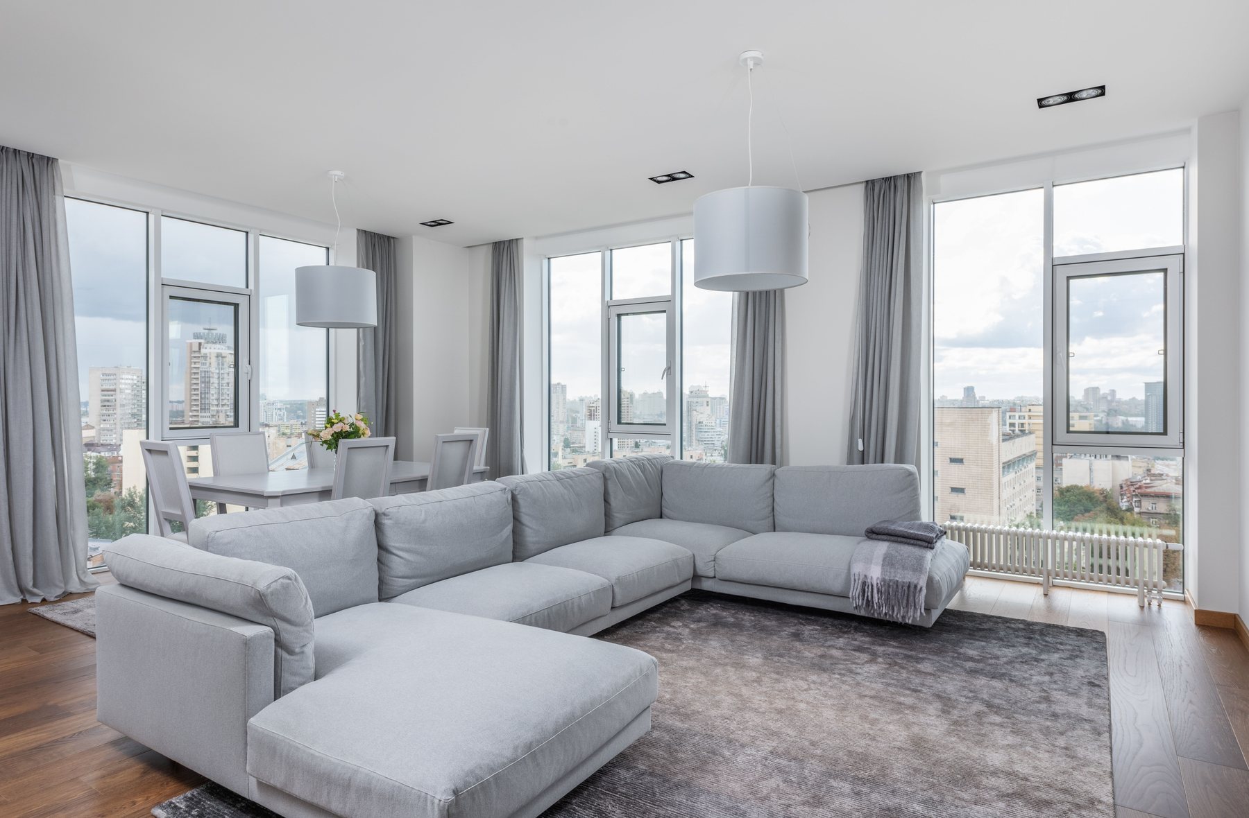Bright living room windows with window treatments
